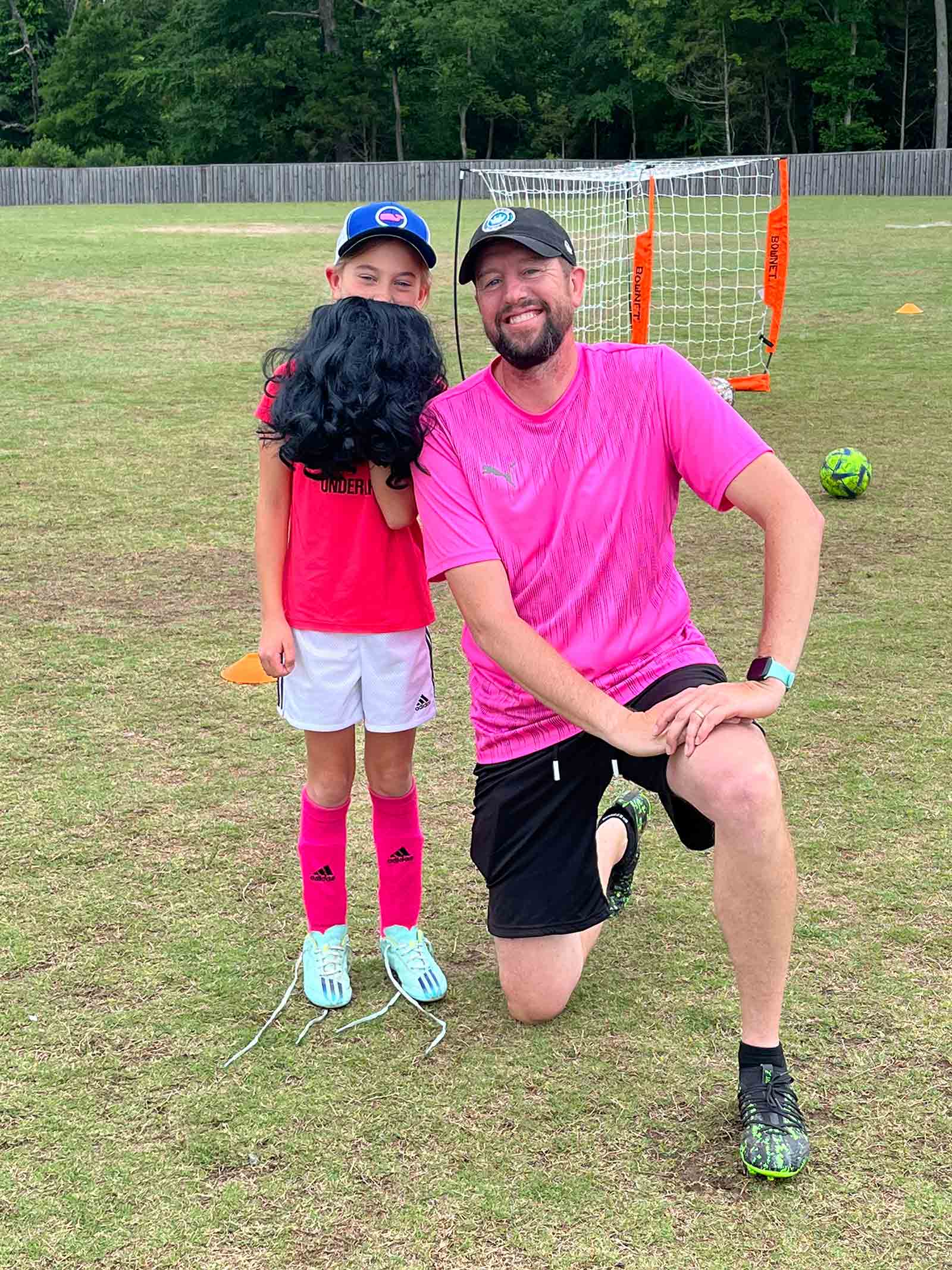 Charlotte Rise FC U8 young player with coach Mike