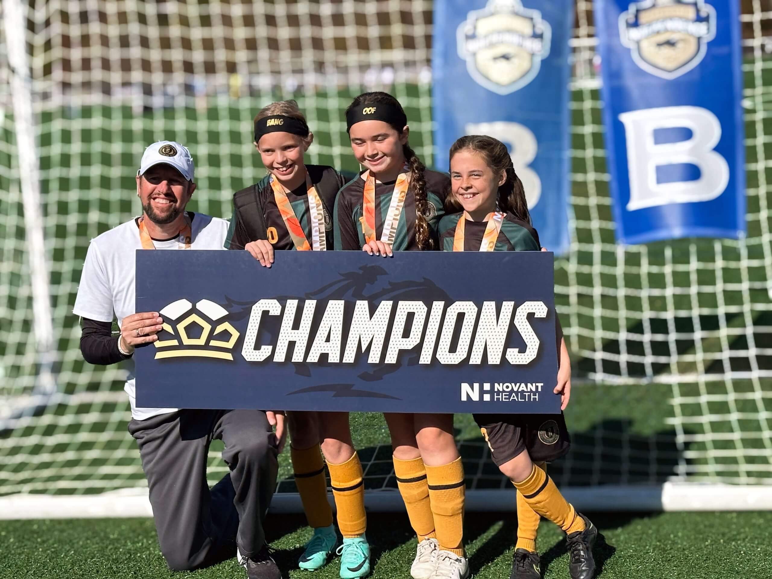 Charlotte Rise FC Youth champions with Coach
